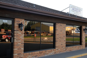 The brick building of Alan B. Evans, DDS, PC with black tinted glasses in Muscatine, IA