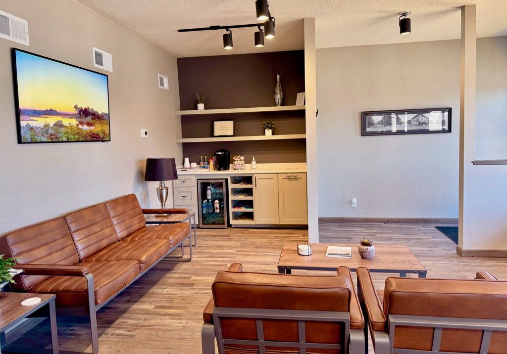 A dentist from Alan B. Evans, DDS, PC using tools to check the teeth of a patient in Muscatine, IA